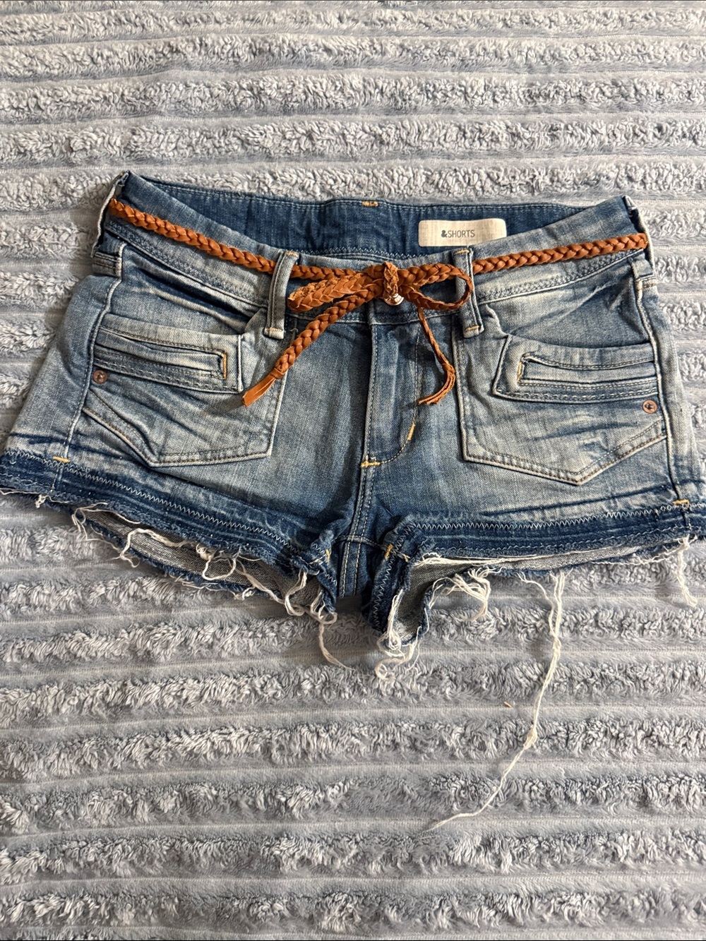 Women's Distressed Blue Denim Cutoff Shorts with Braided Tan Belt